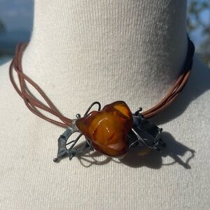 Vintage russian hand curved amber rose, silver leaves on leather chocker.